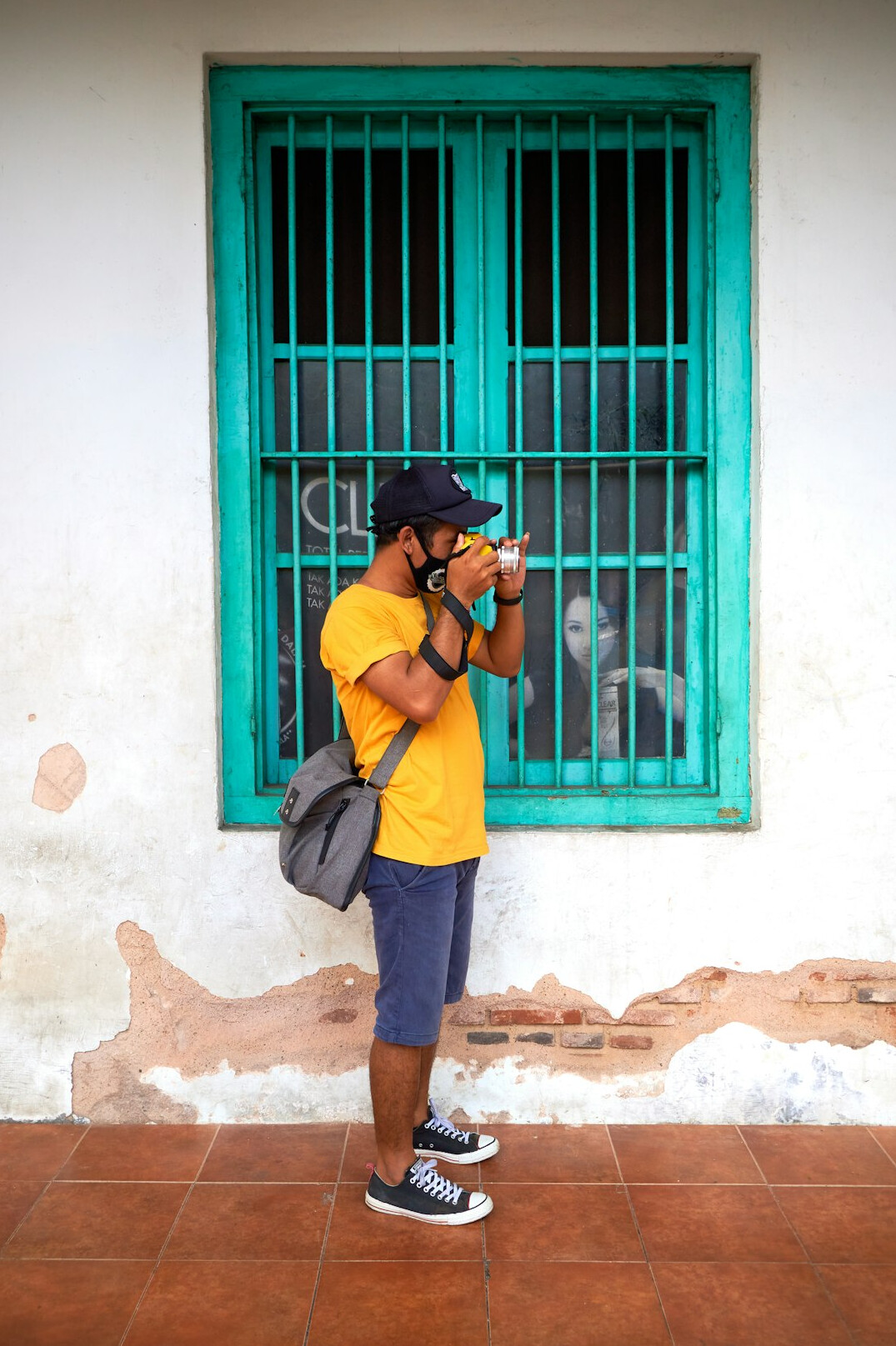 Photographer photographing a local resident during a reportage