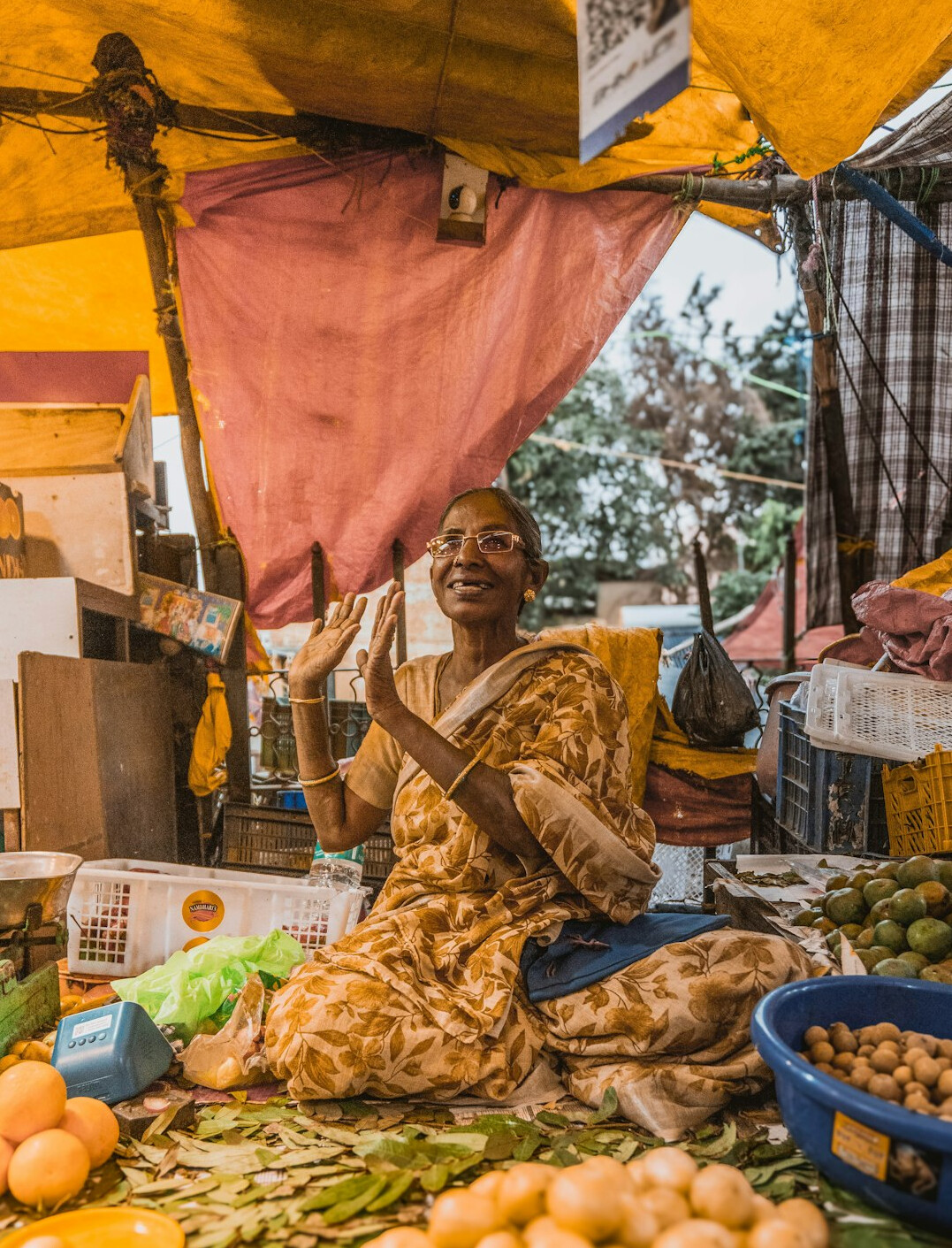 woman selling vegetables at market