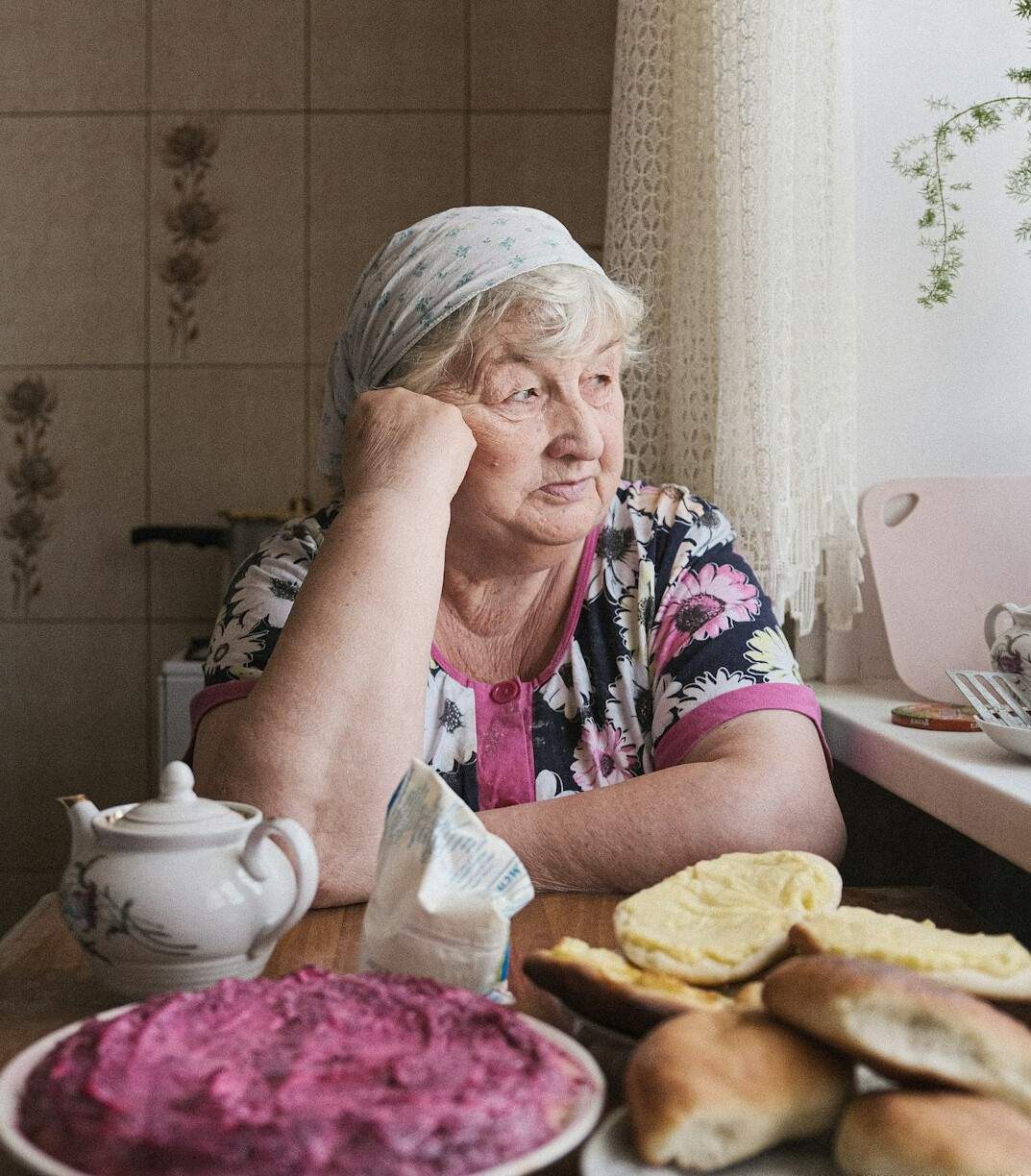 elderly woman baking bread