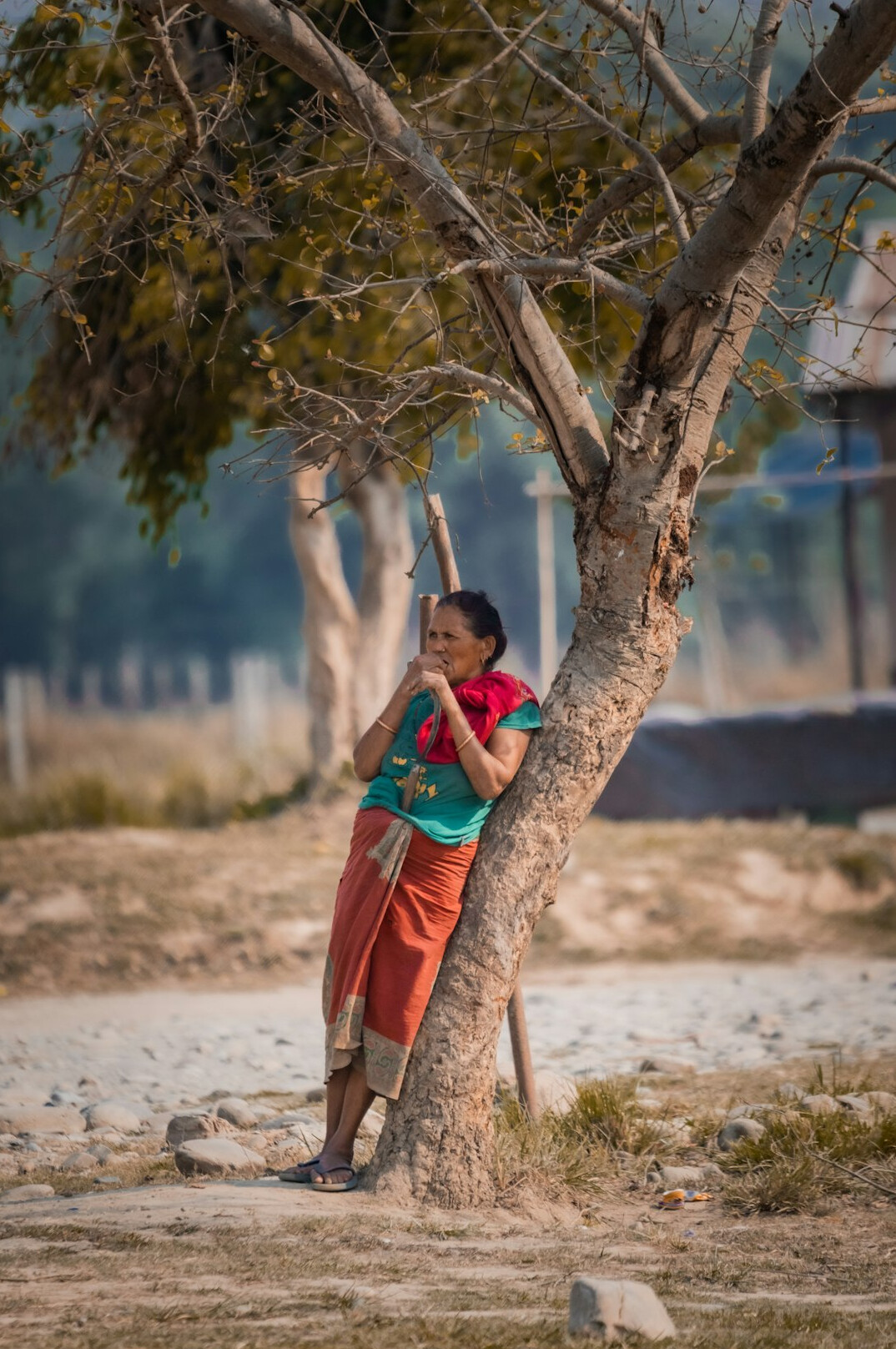 young photographer with camera in village