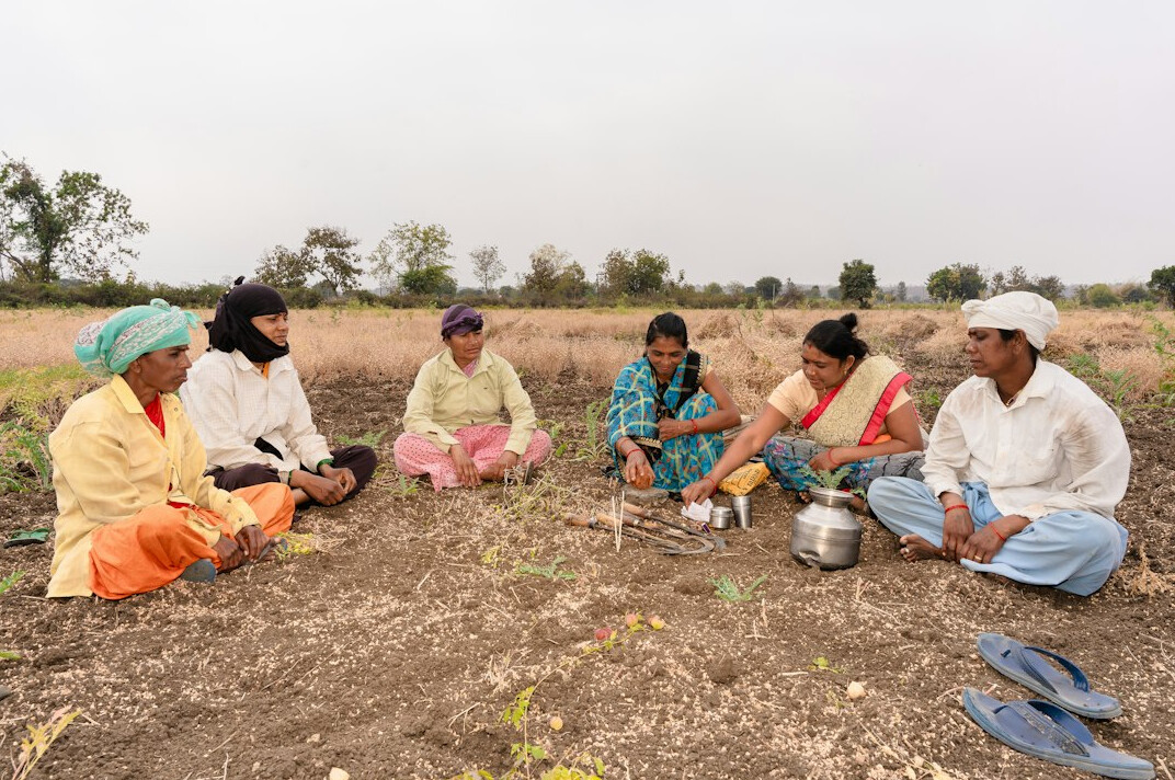 person sharing story in village