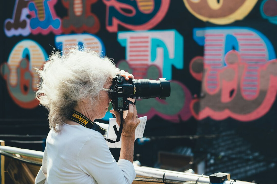 photographer talking to elderly woman